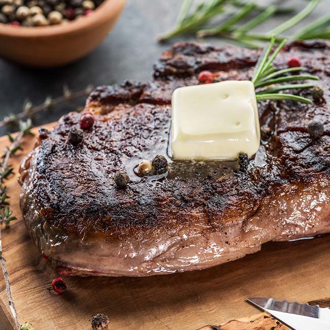 Grilled steak with melting butter and rosemary, served at The Depot in Green Bay.